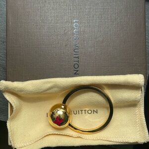 Authentic LOUIS VUITTON Sphere Key Ring. Comes with box and dust bag.